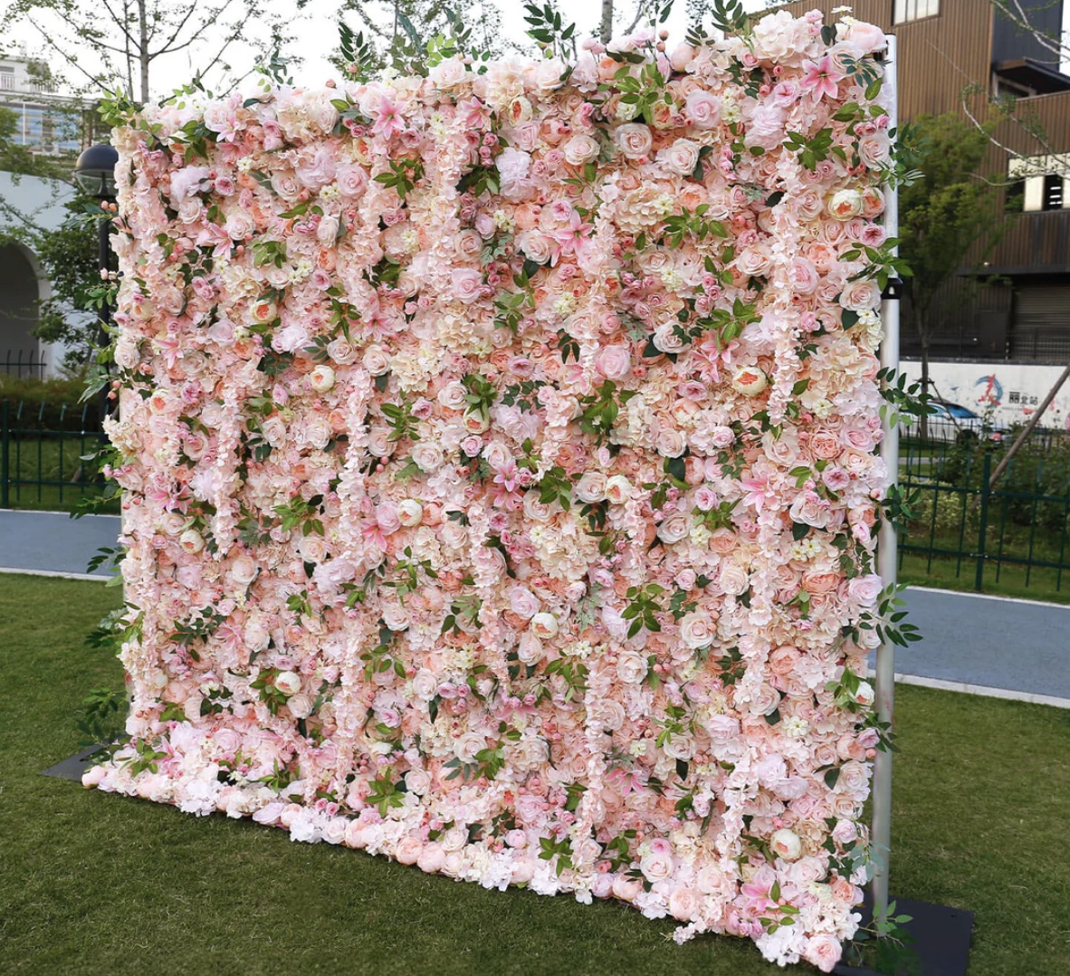 The Love Language blush pink flower wall rental displayed outdoors for a Middle Tennessee event.